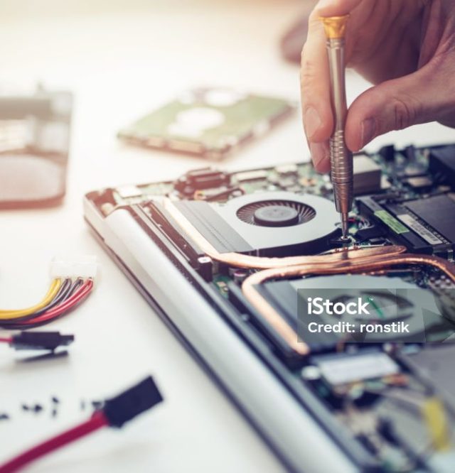 technician repairing laptop computer closeup